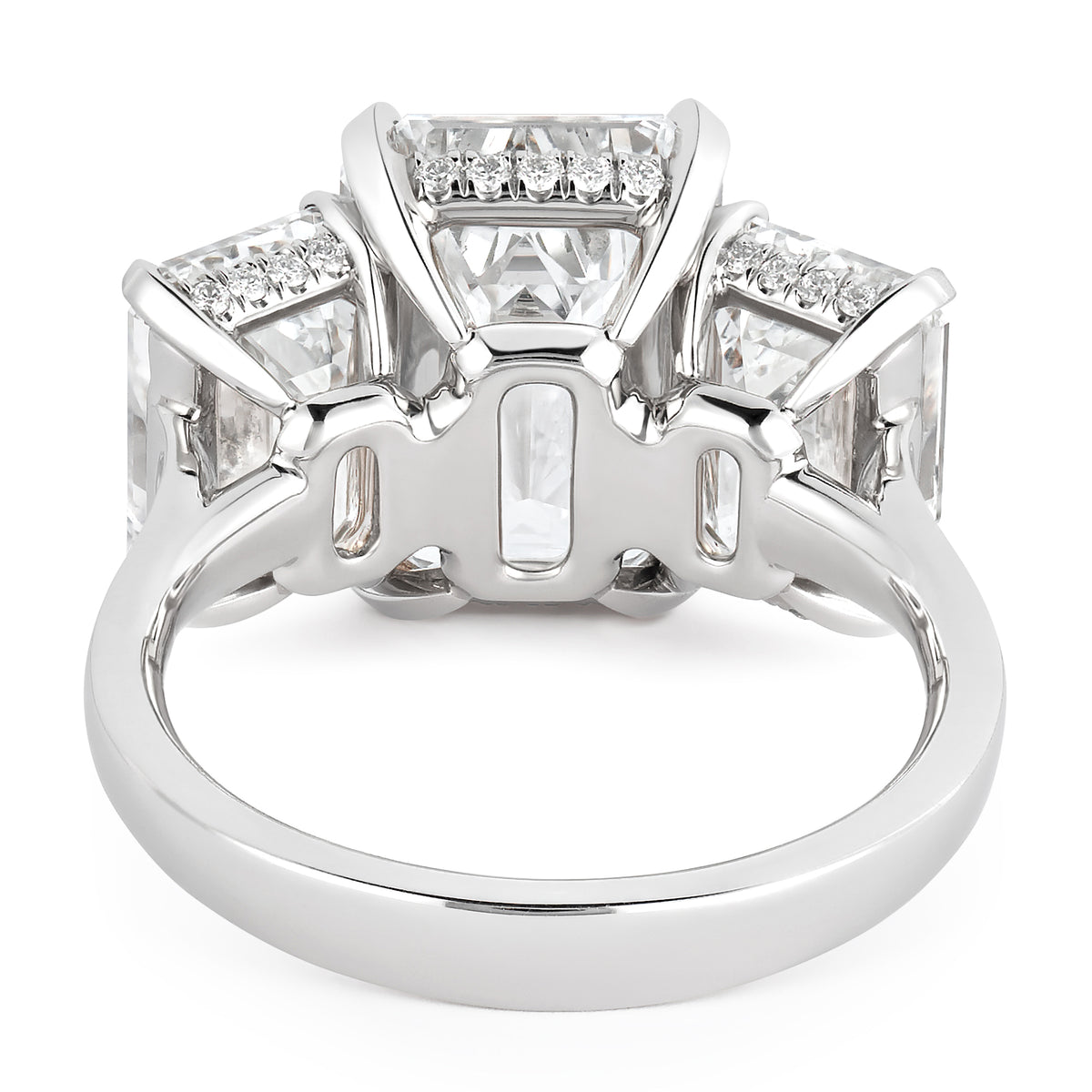 BESPOKE EMERALD CUT THREE STONE RING