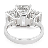 BESPOKE EMERALD CUT THREE STONE RING